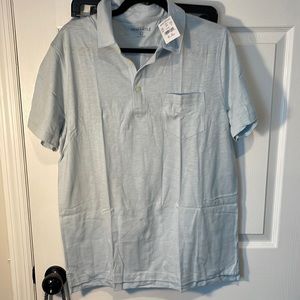 Beautiful light blue polo shirt with front pocket